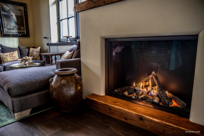 A fireside sitting room with a gas fireplace
