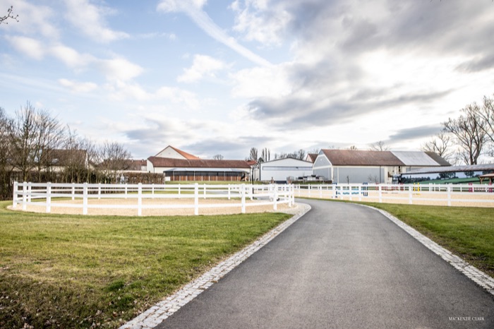 Path leading to the outdoor round pen and stable buildings