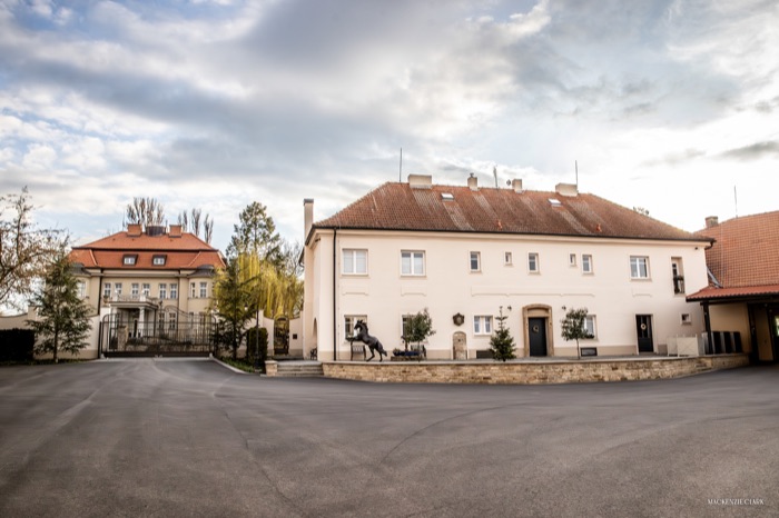 The estate courtyard, with the manor and stable buildings