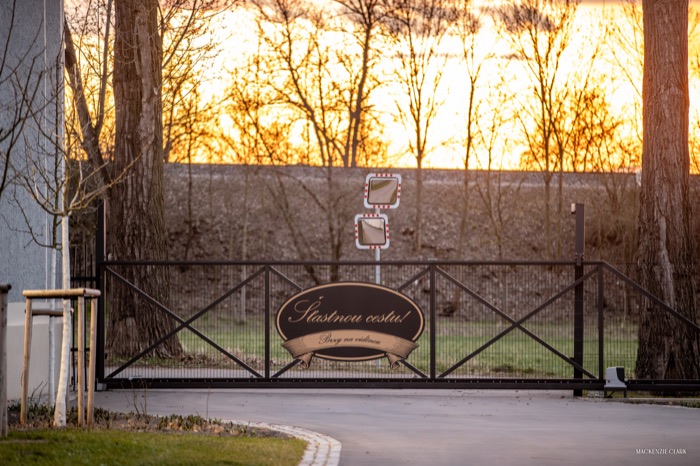 The exit gate at sunset, with a Czech farewell sign